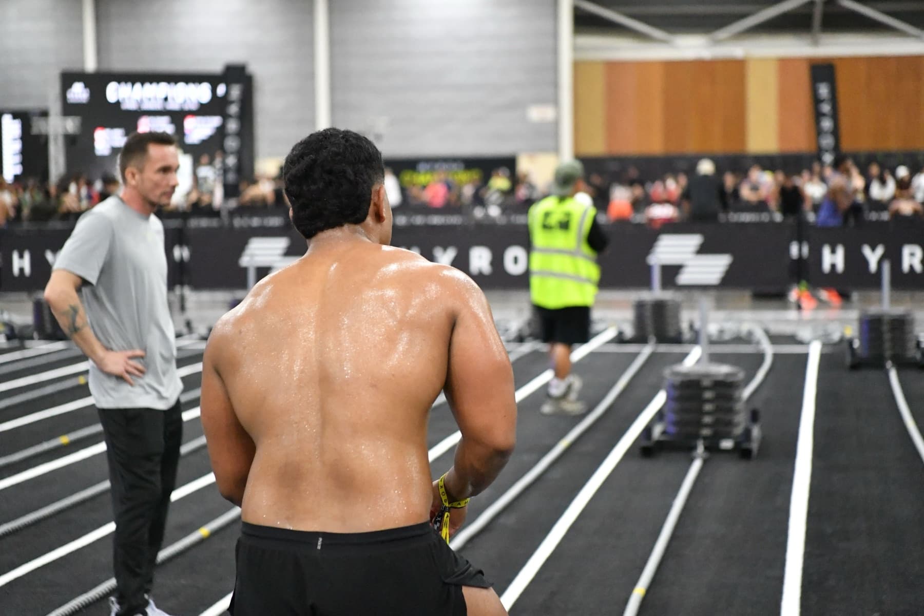 Functional fitness athlete entering a competition floor