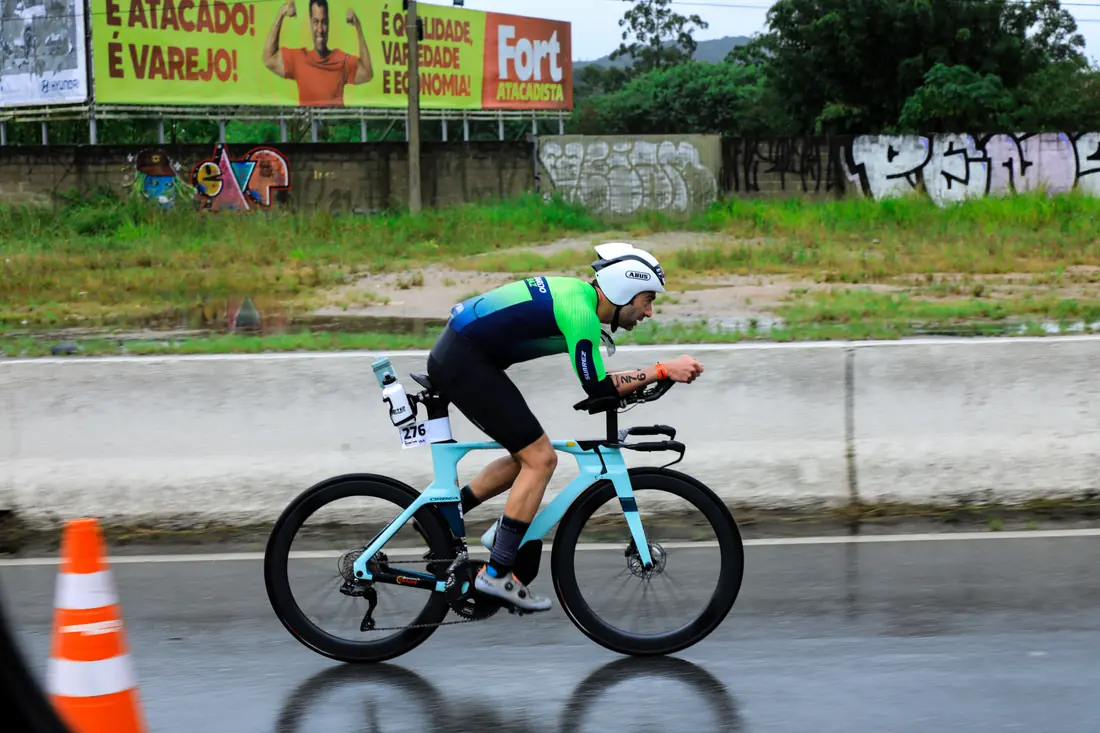 Runner mid-stride at a road race finish line
